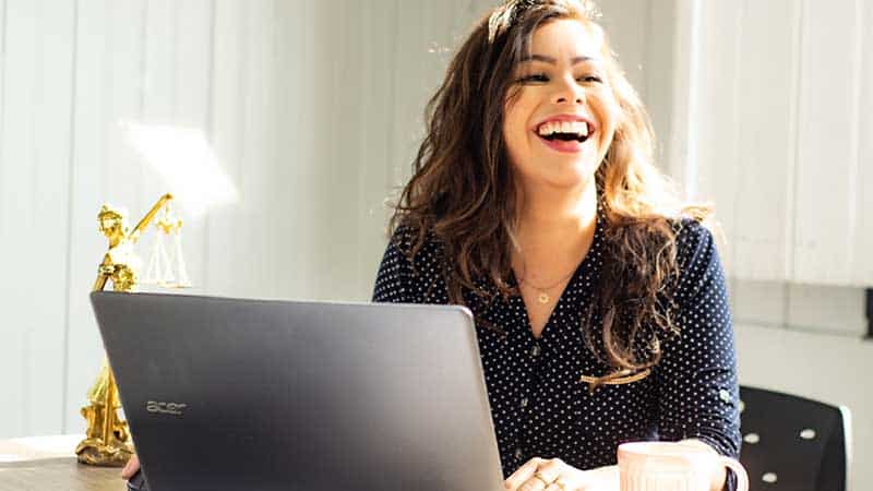 woman smiling with laptop
