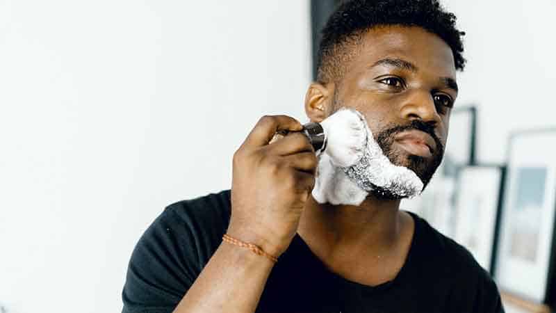 man using shaving brush