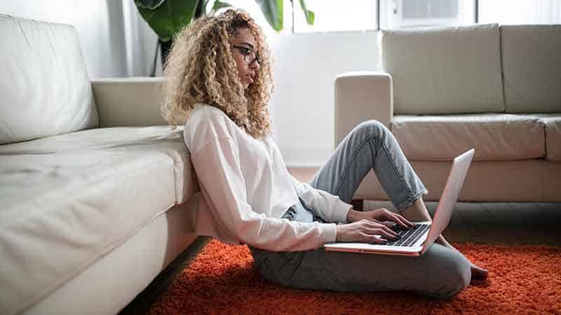 woman typing on laptop