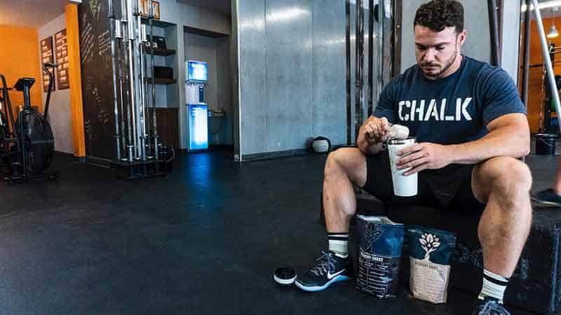 athletic wear affiliate programs - man making protein shake