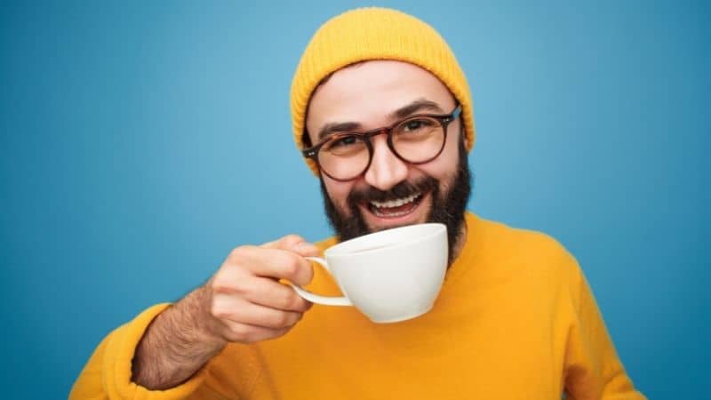 person holding coffee cup