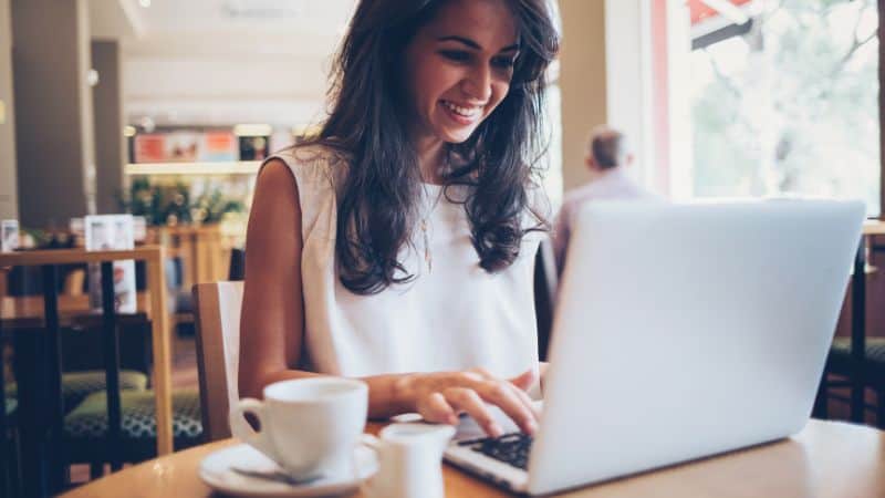 woman typing on a laptop